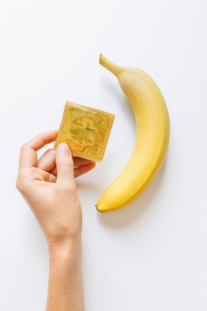 services-02 Conceptual image featuring a banana and a condom to promote safe sex education and prevention.